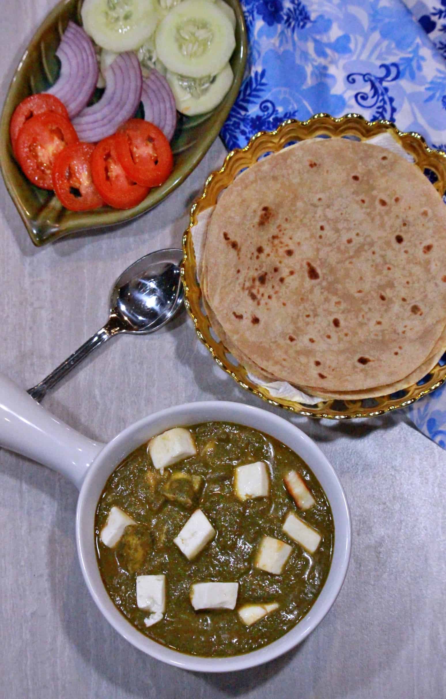 Palak paneer subzi in white bowl with roti