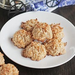 coconut macaroons stacked in a white plate