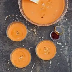 carrot kheer in glasses and bowl with saffron on the side