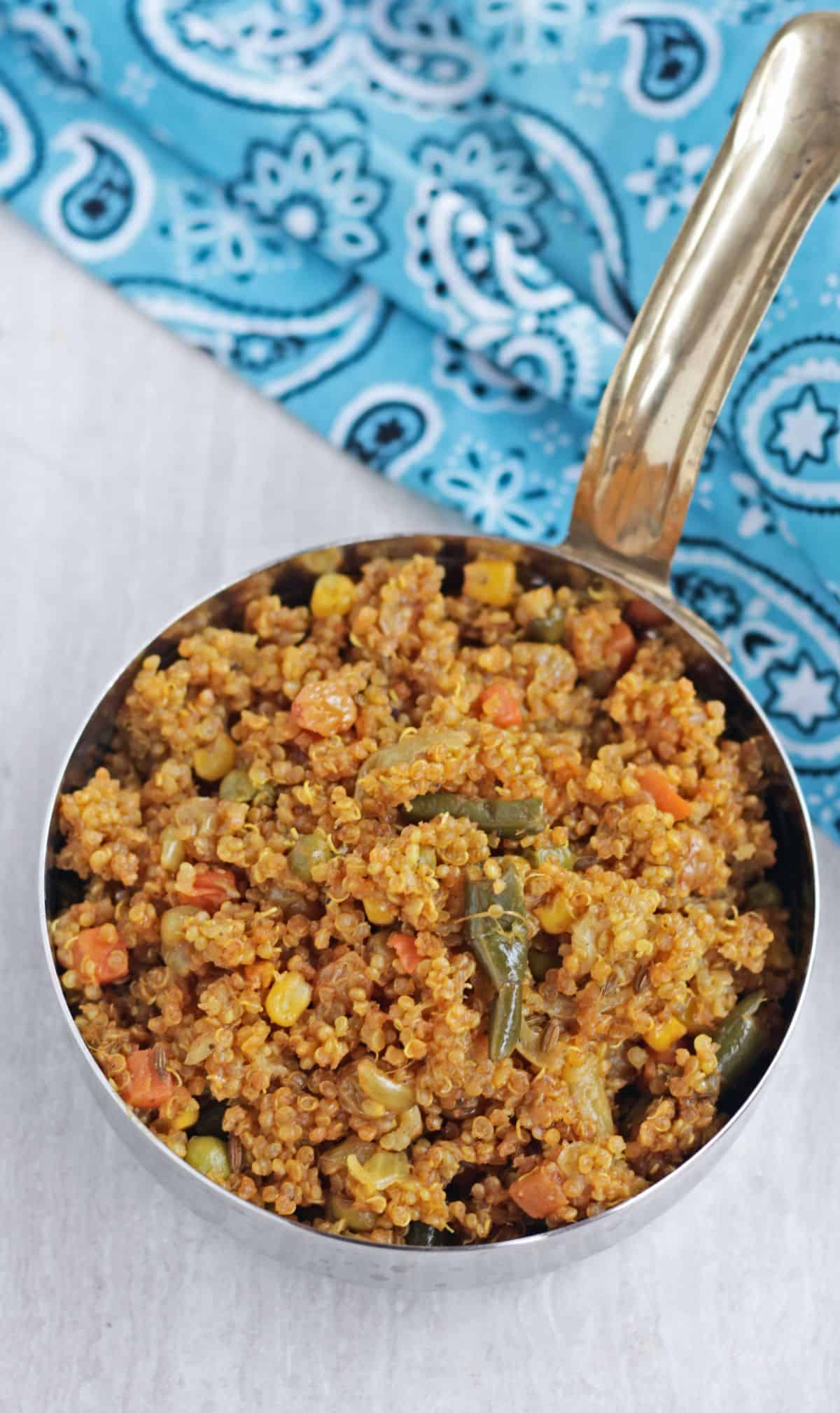 quinoa pulav in a steel bowl with handle