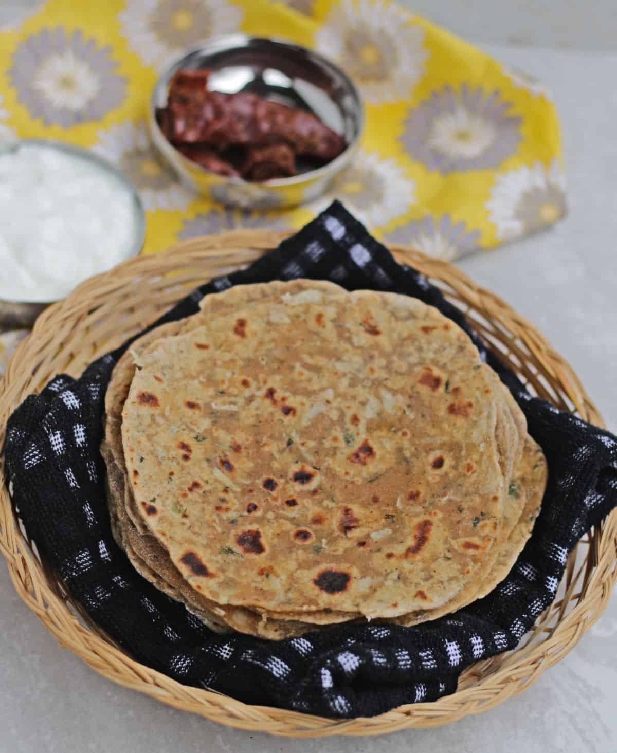 paratha stacked in a basket.