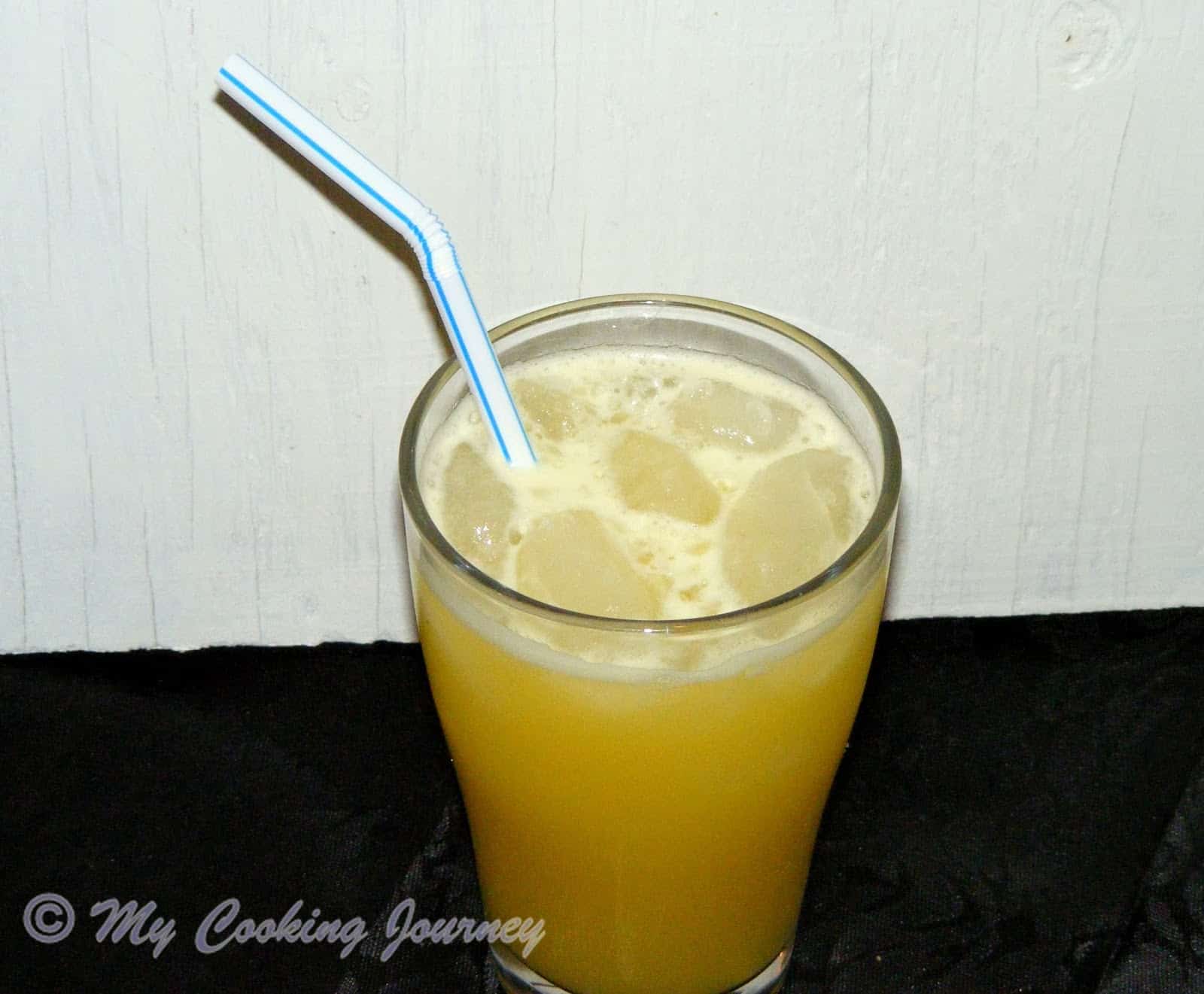 Ginger Beer in a glass with straw