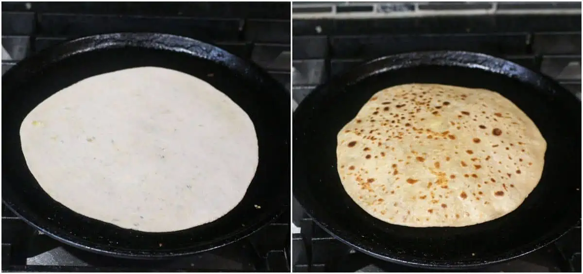 cooking paratha on a cast iron griddle.