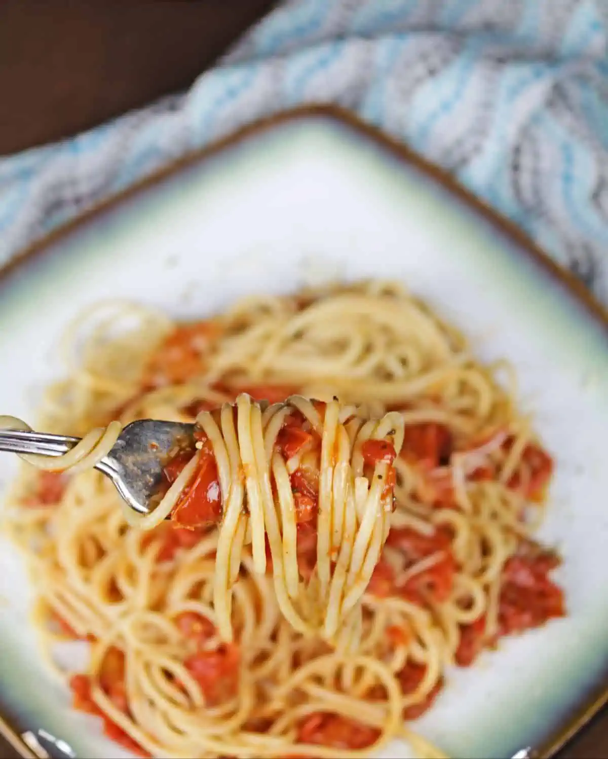 spaghetti with pasta sauce in a fork