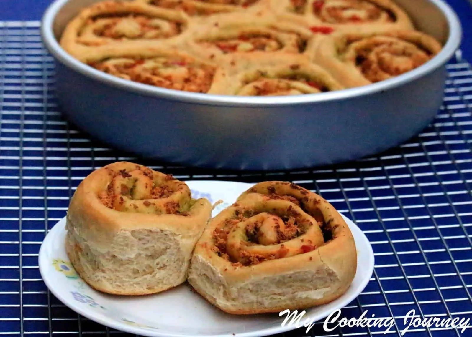 Savory Swirl Buns in a plate and baking pan