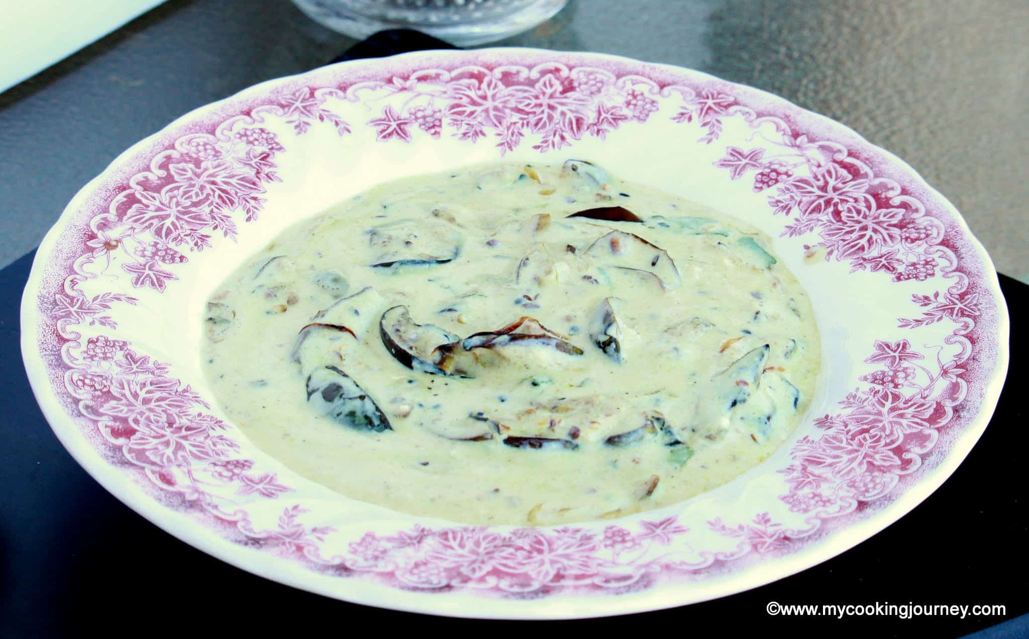Dahi Baingana in a white bowl