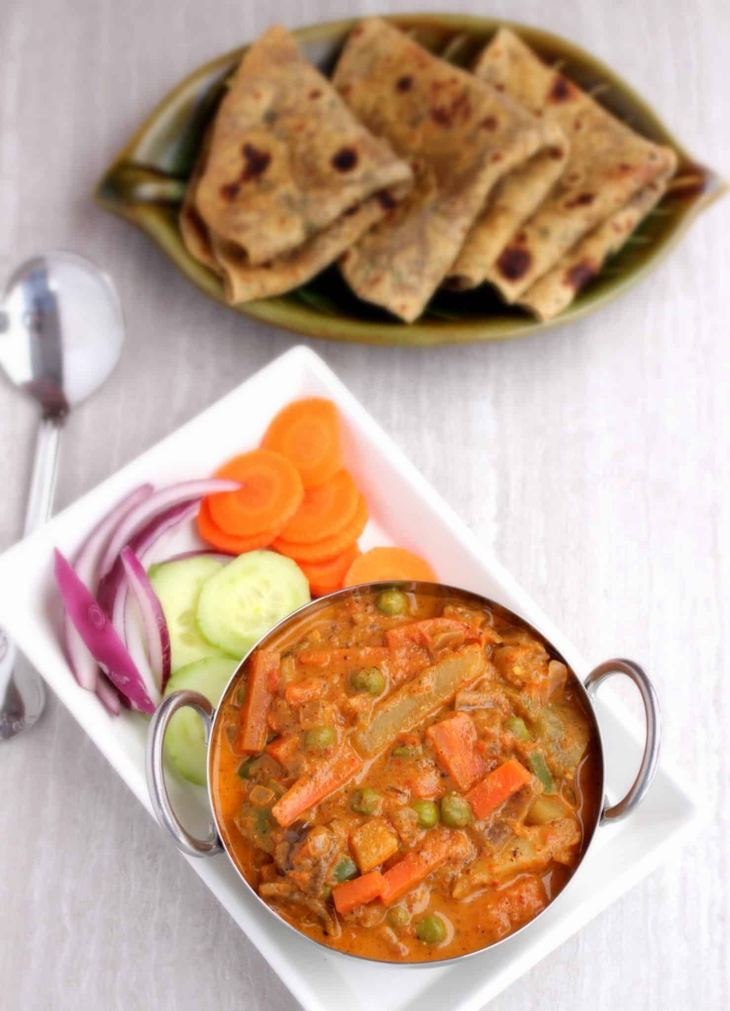 Kadai Vegetable Gravy - Final product with raw onions, cucumbers, carrots and roti