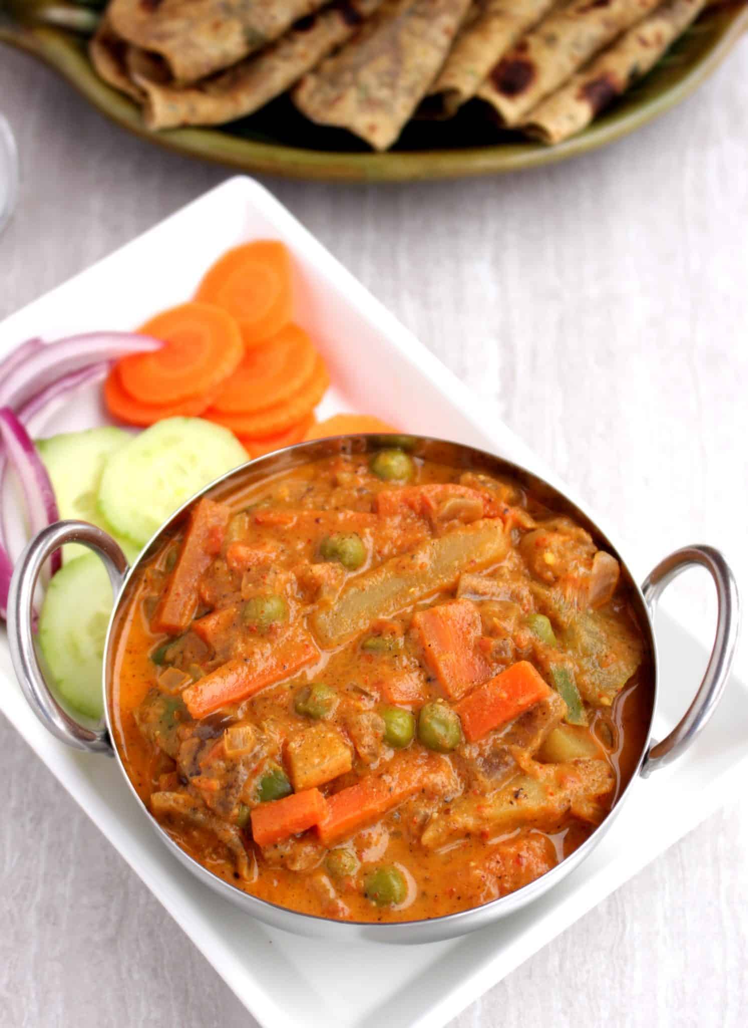 Kadai Vegetable Gravy with cucumber, tomato, Onion and carrot on the side