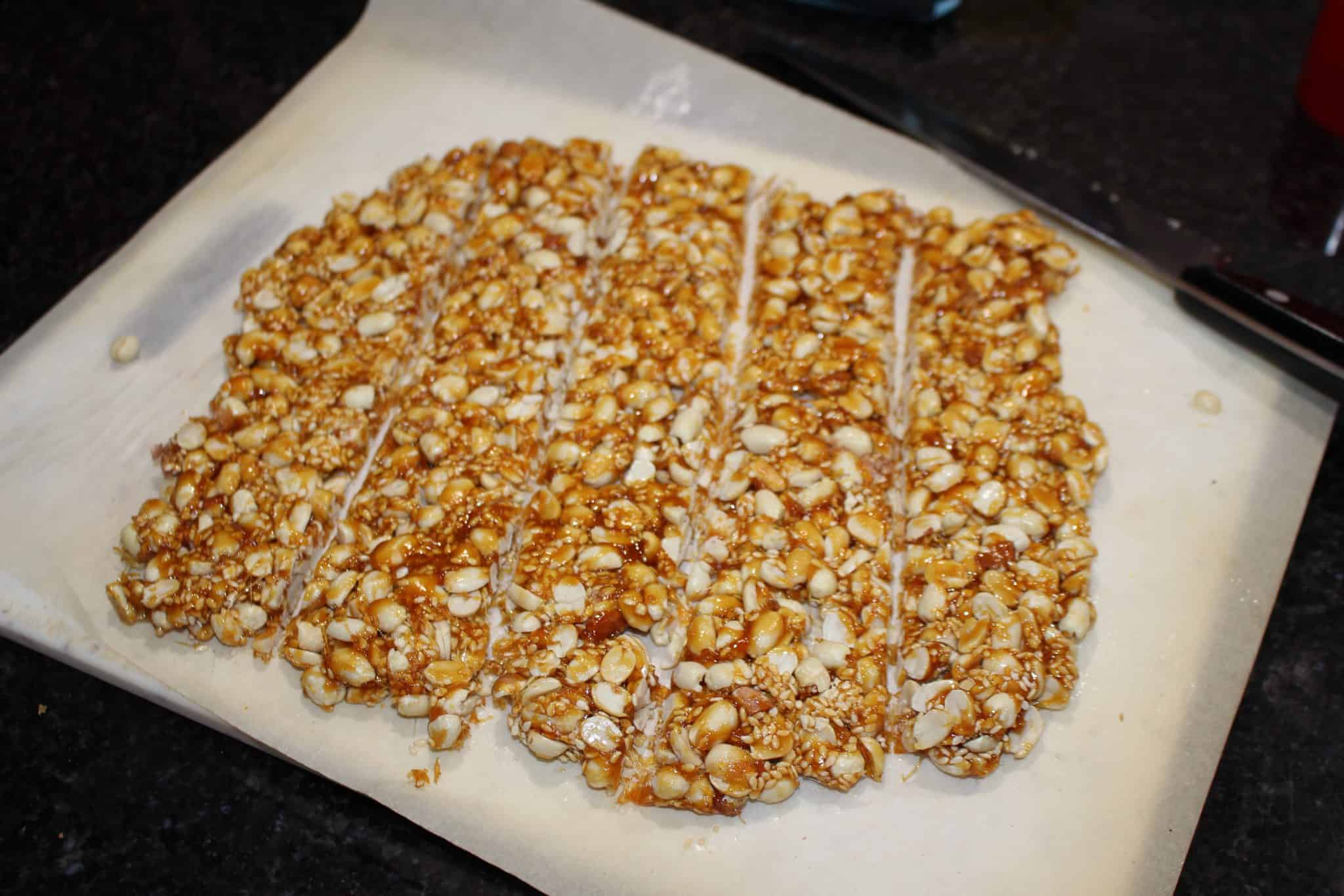 peanut sesame ginger brittle on a baking dish