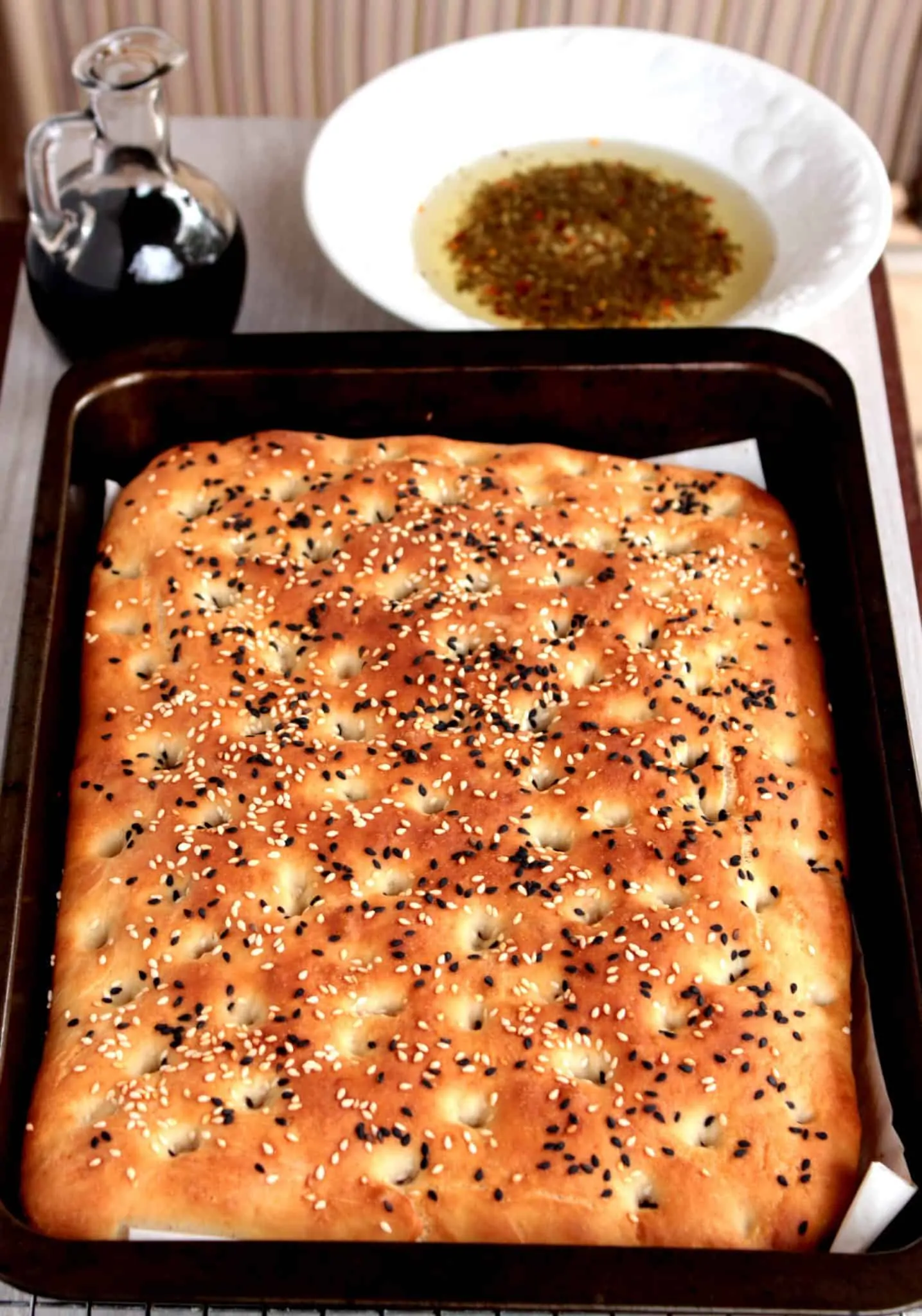 A tray of golden baked flatbread. 