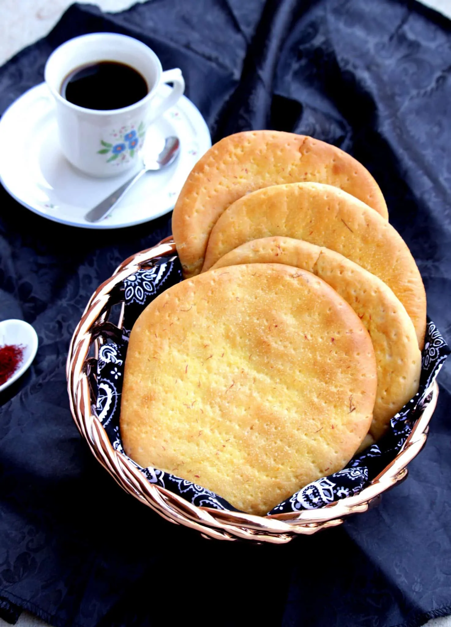 Sheermal / Shirmal - Saffron Flavored Flat Bread served in a plate with tea