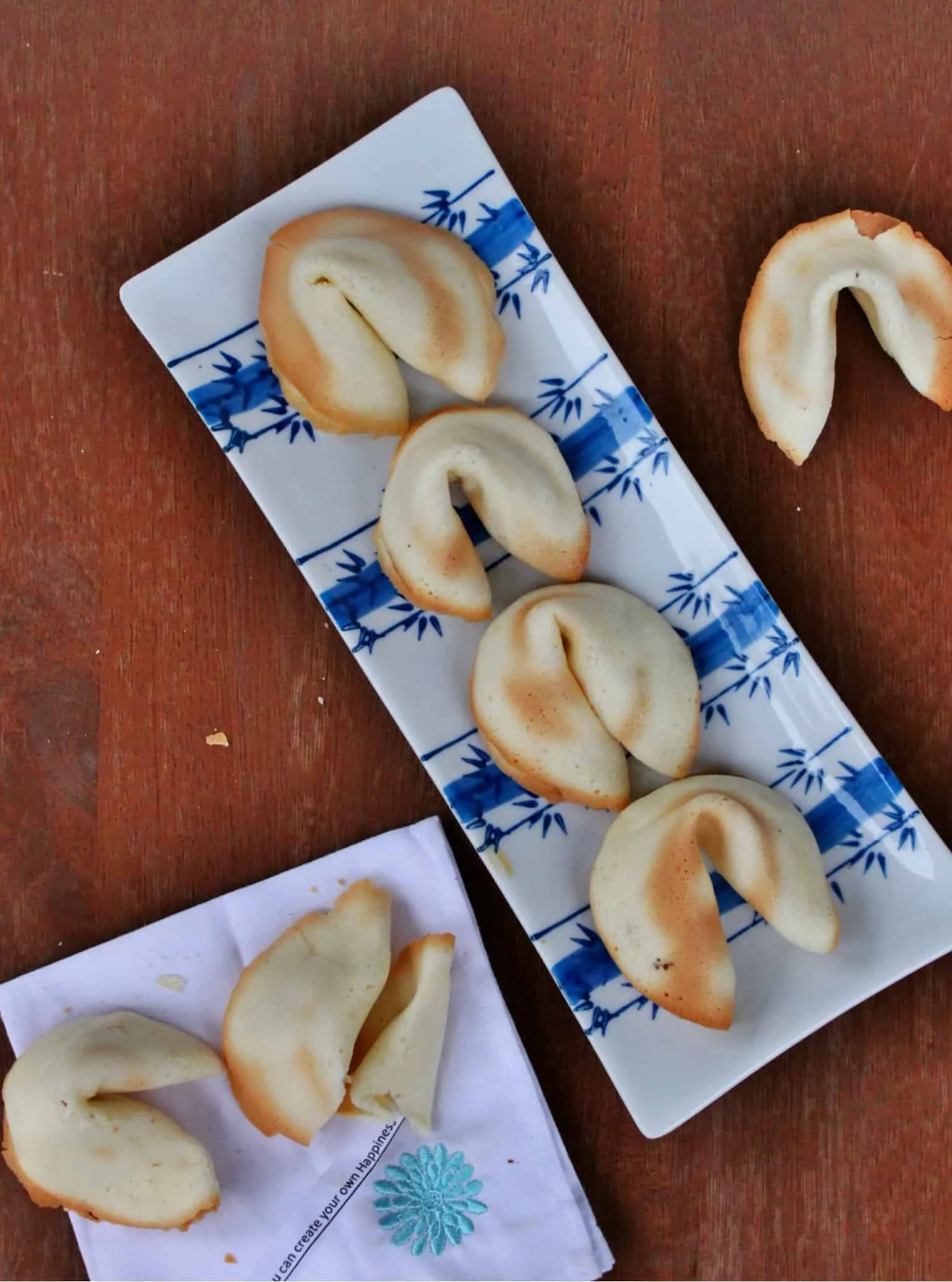 Homemade Fortune Cookies in a tray and some on a napkin