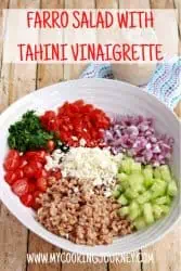 farro salad with vegetables in a white bowl and text