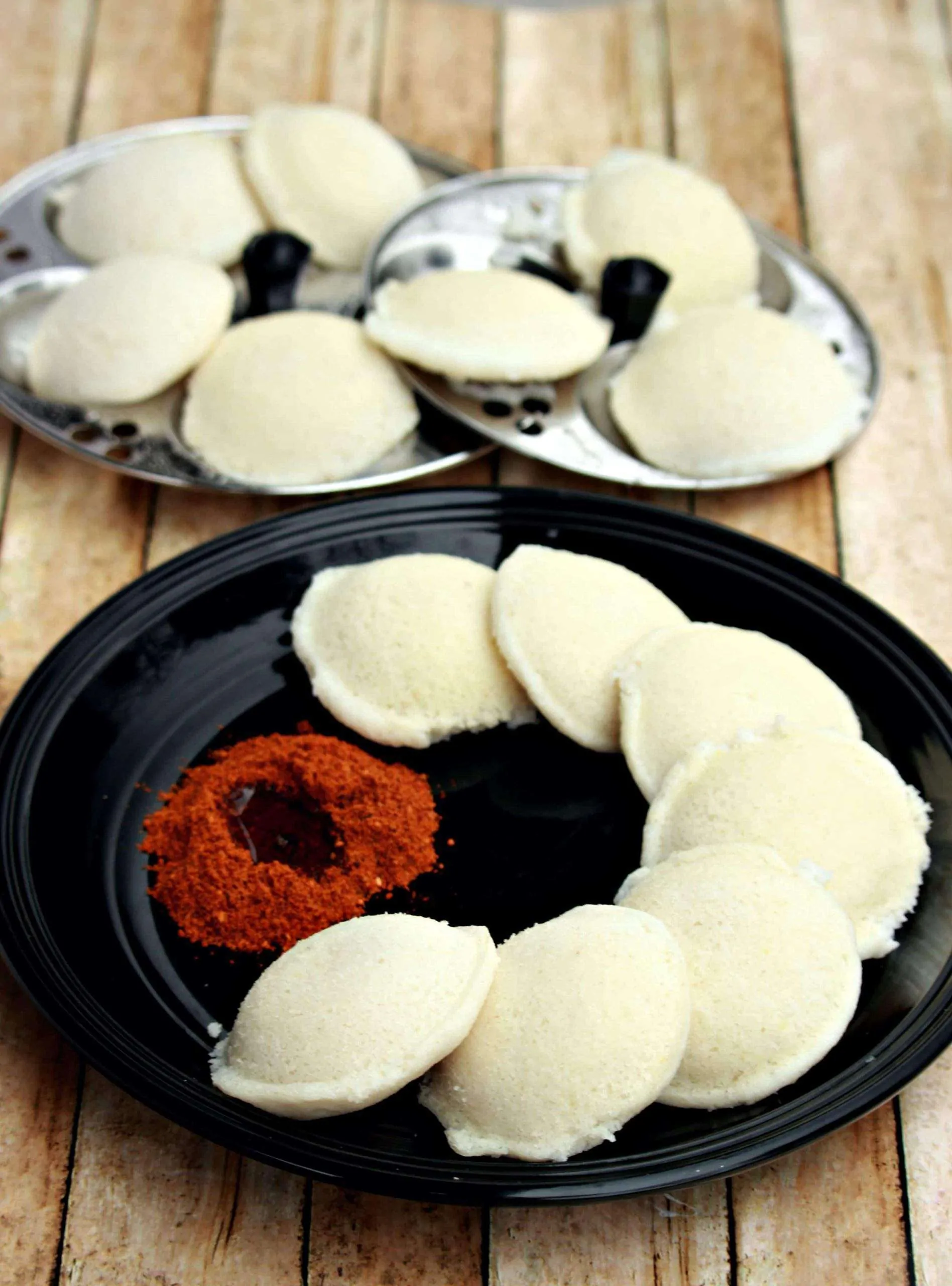 Steamed Idli served with sauce.
