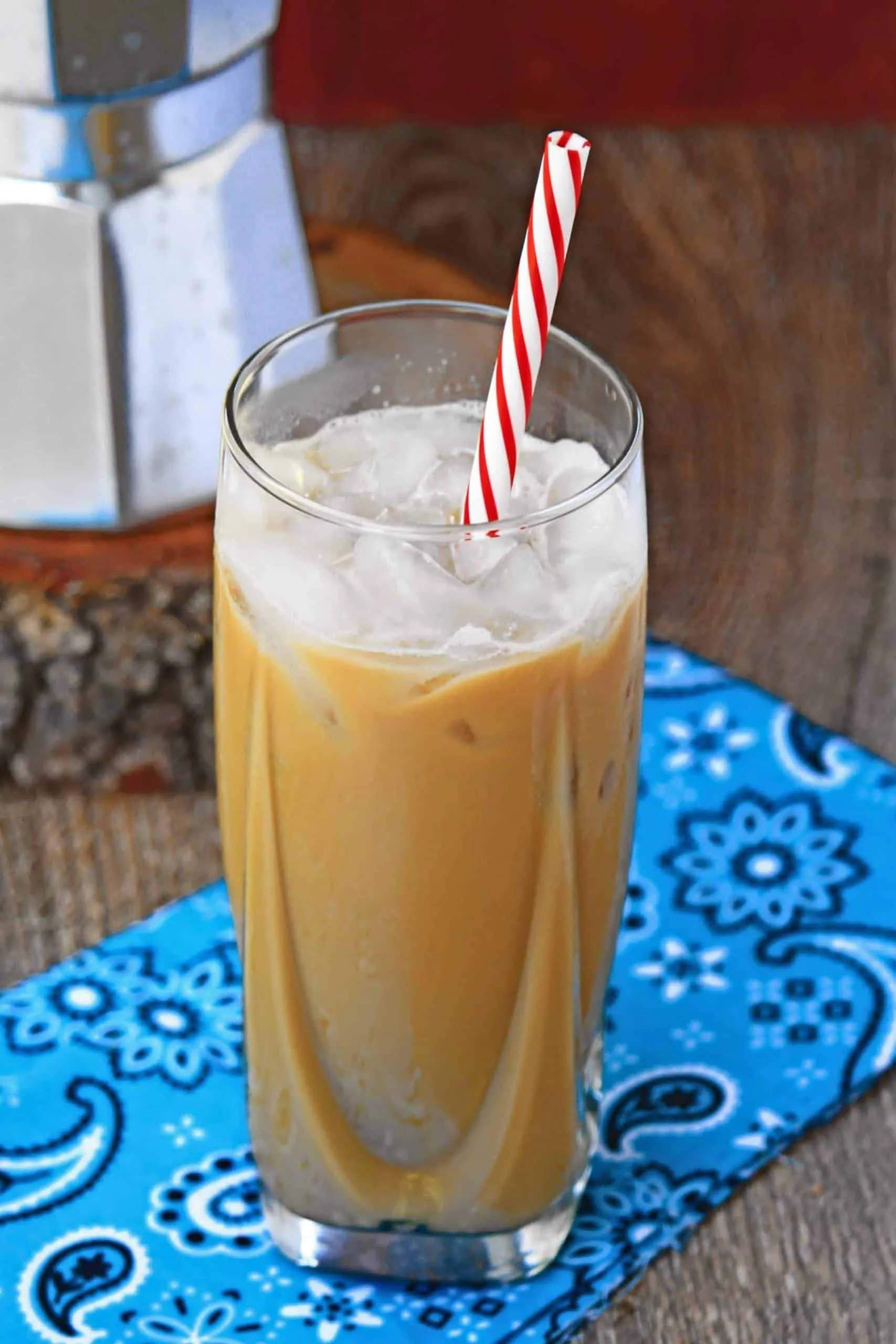 Vietnamese Iced Coffee in a tall glass cup with straw