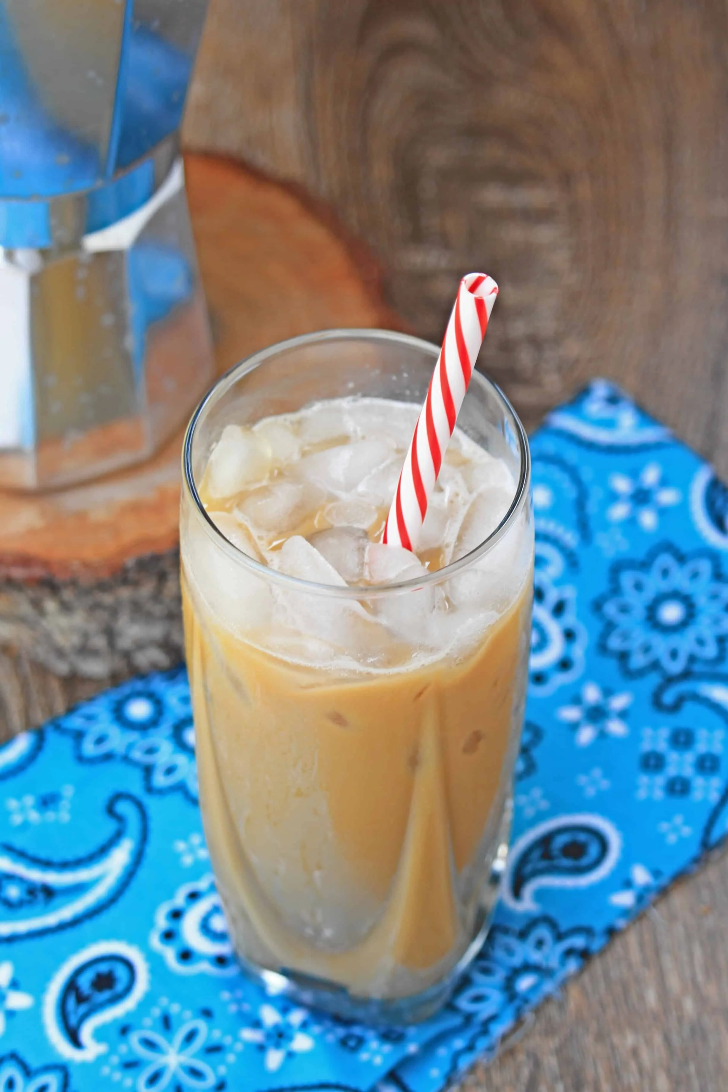 Ca Phe Sua Da in a tall glass with ice and straw