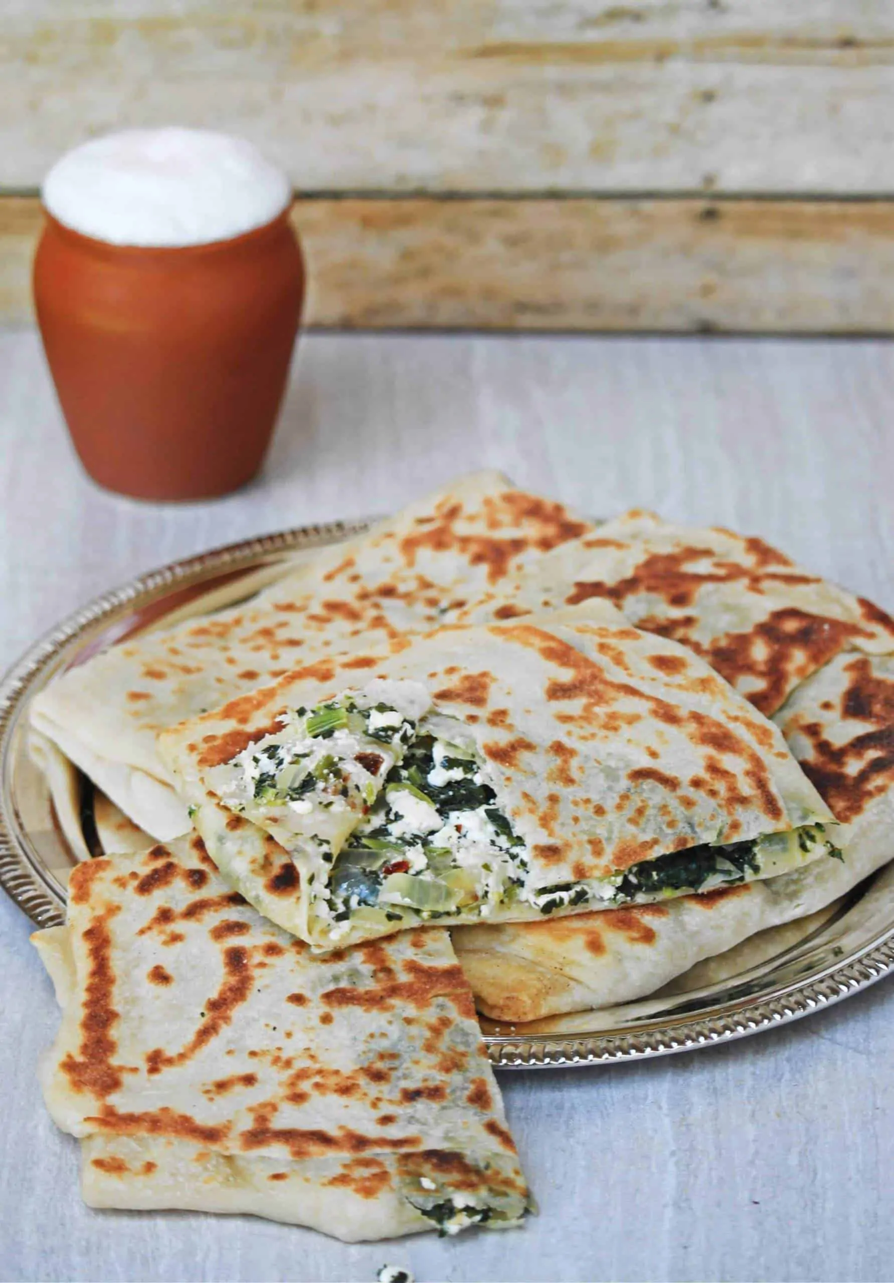 Gozleme | Turkish Spinach and Feta Flatbread with buttermilk in background