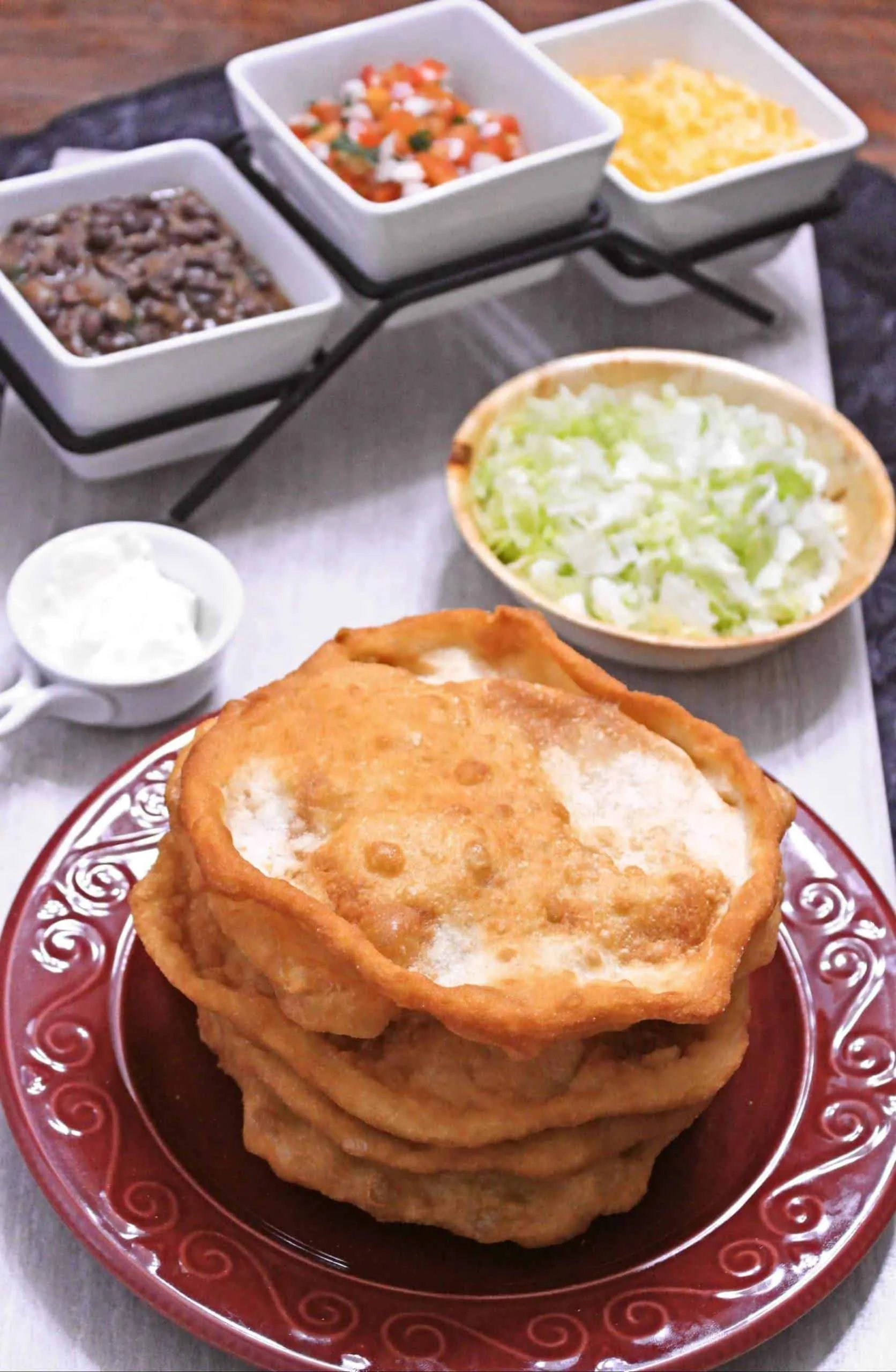 Fry bread with beans, lettuce, cheese and salsa on the side