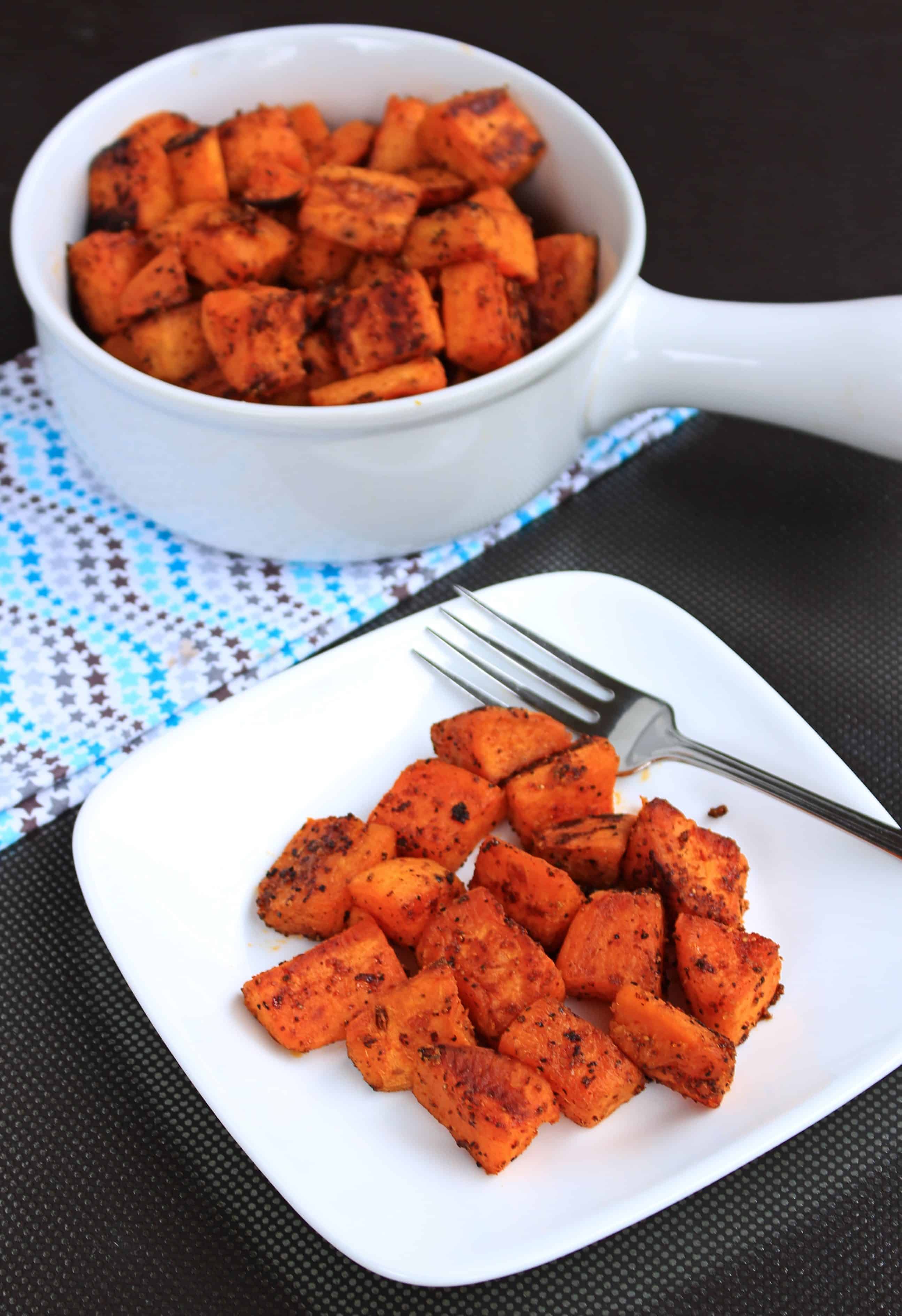 Spicy Oven Roasted Sweet Potatoes served in a dish.