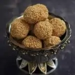 sesame seed ladoo in a silver bowl