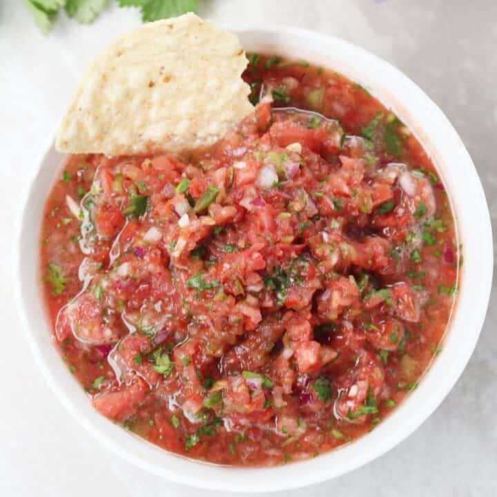 Salsa in a bowl with a tortilla chip