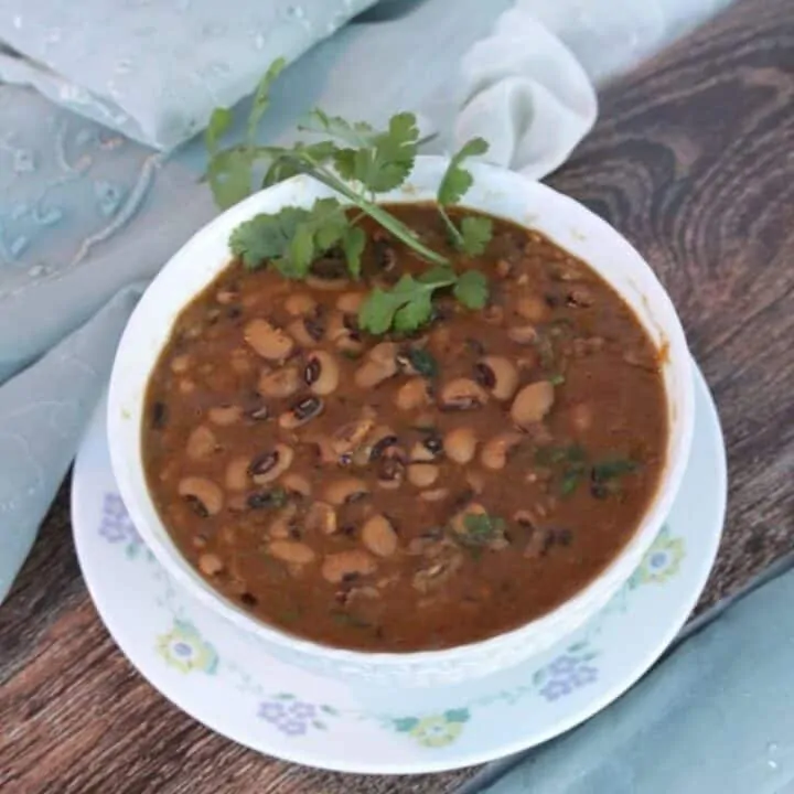 Black eyed peas curry in a white bowl