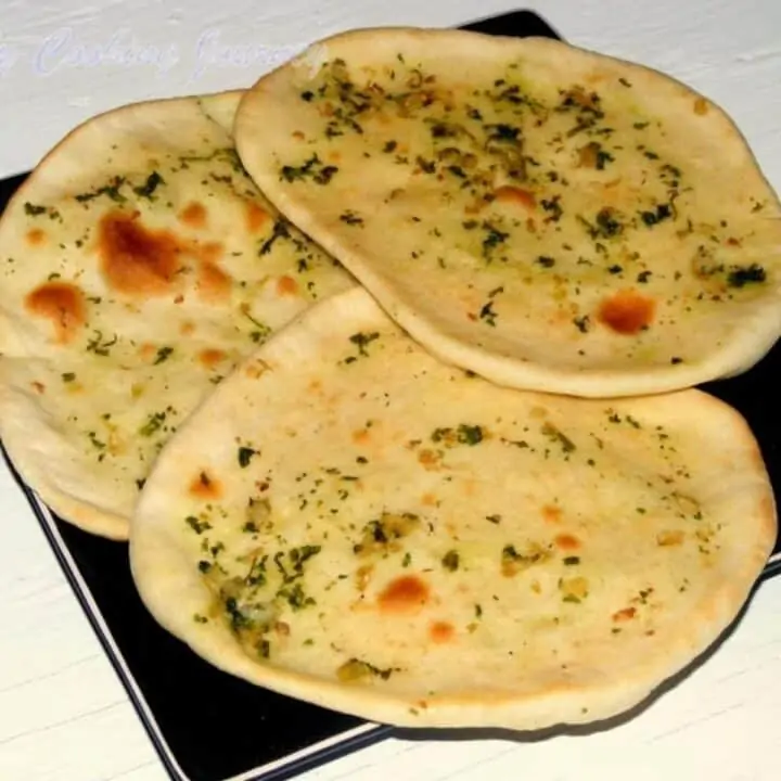 3 garlic naan in a plate