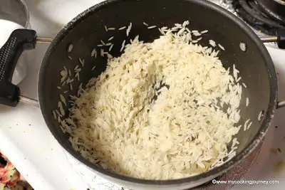 sauteing rice in a pan
