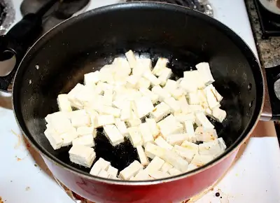 frying the tofu in a pan
