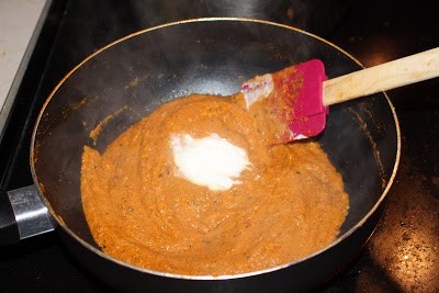 Mixing curry with spatula