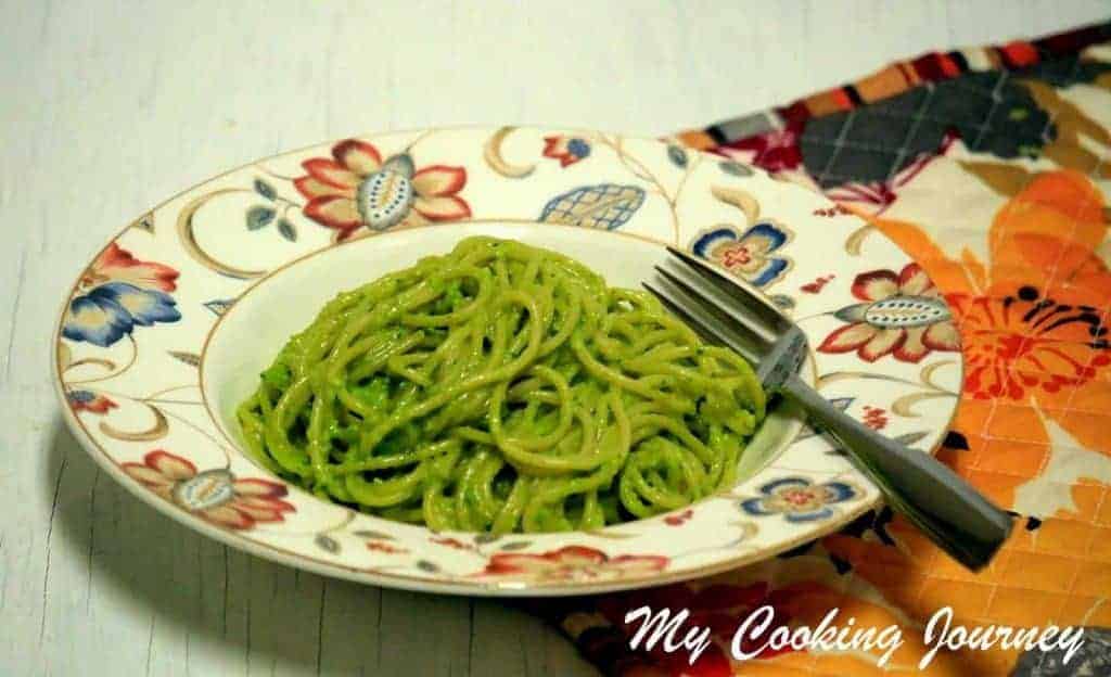 Basil-Pine Nut Pesto served in a dish with folk