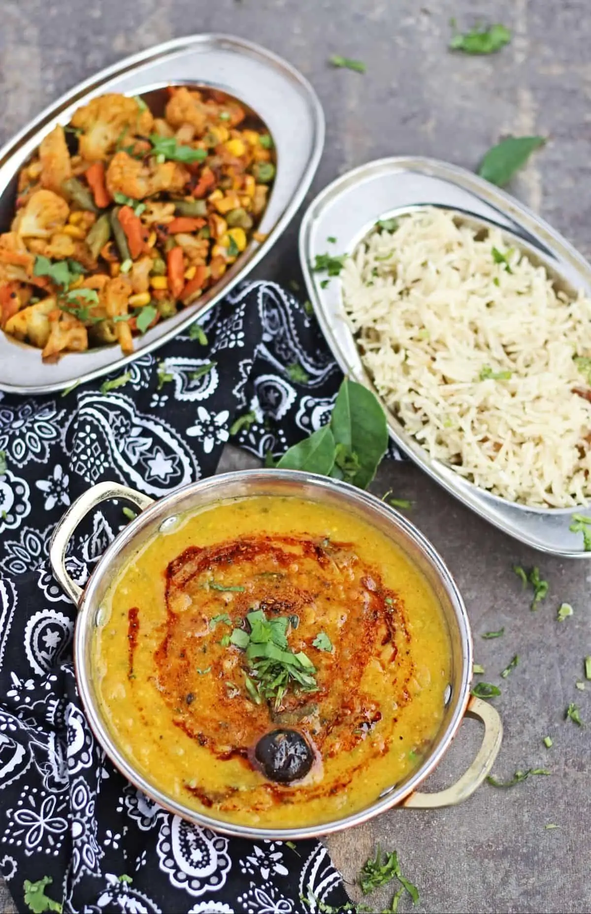 Mango toor dal with rice and vegetables on side
