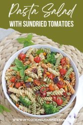 Colorful pasta salad in a white bowl with overlaying text
