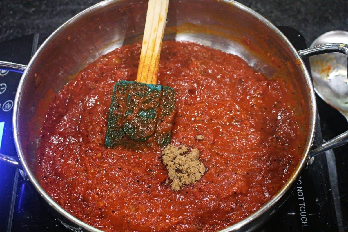 tomato pickle in a pan with brown sugar