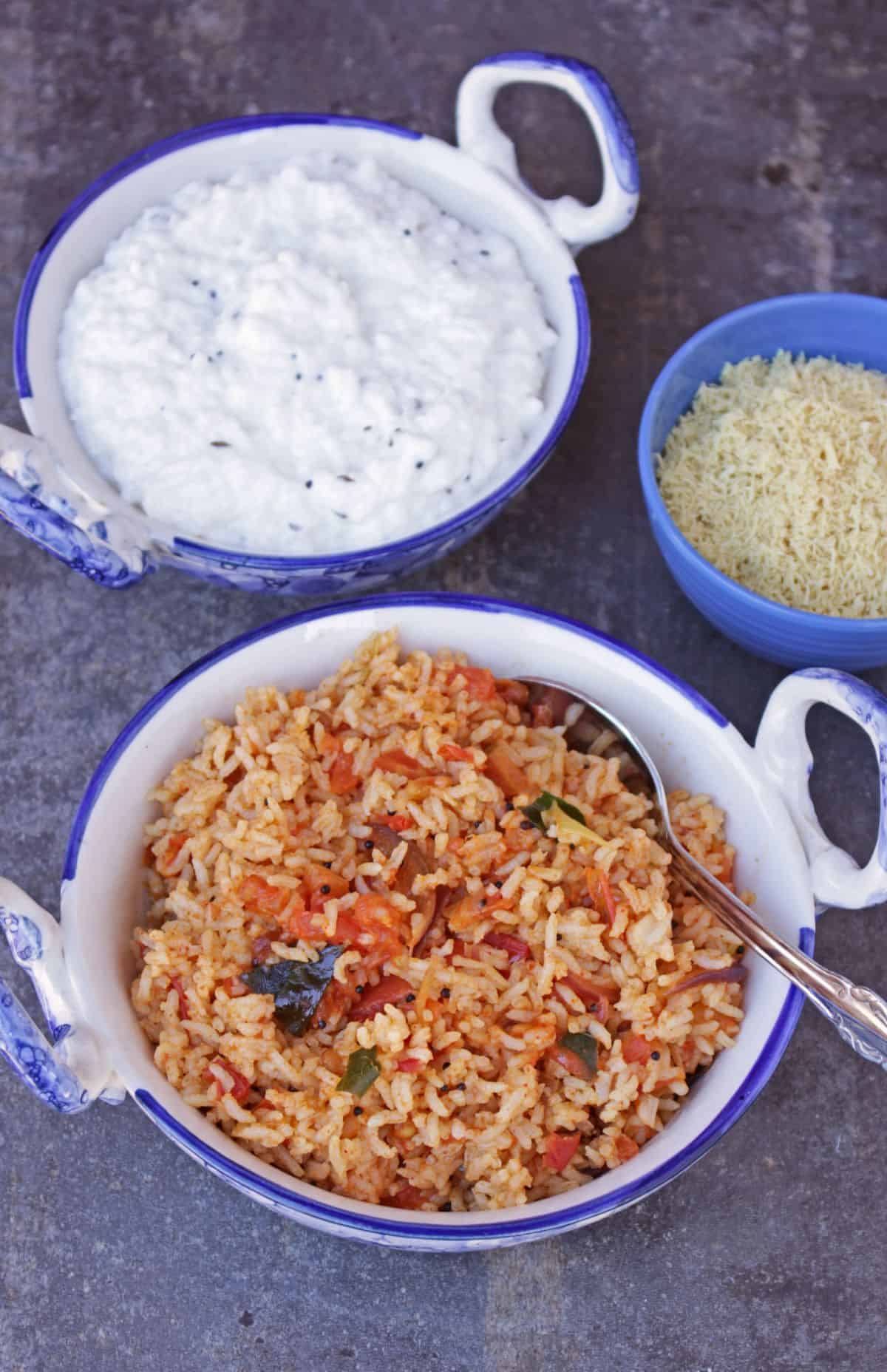 tomato rice with curd rice in the background