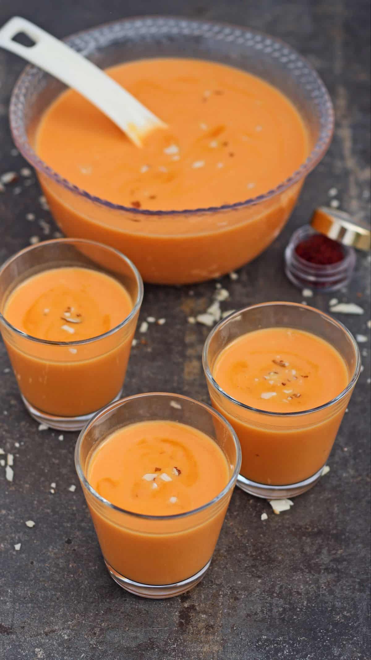 carrot kheer in 3 glasses and in a bowl