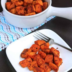 Spicy Oven Roasted Sweet Potatoes served in a plate