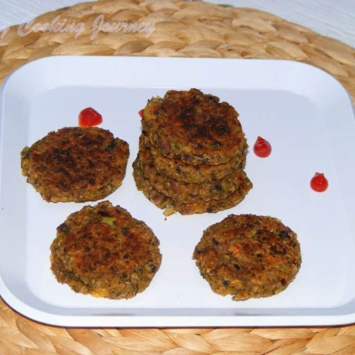 Broccoli Quinoa and Bean Fritters in a white plate - Featured Image