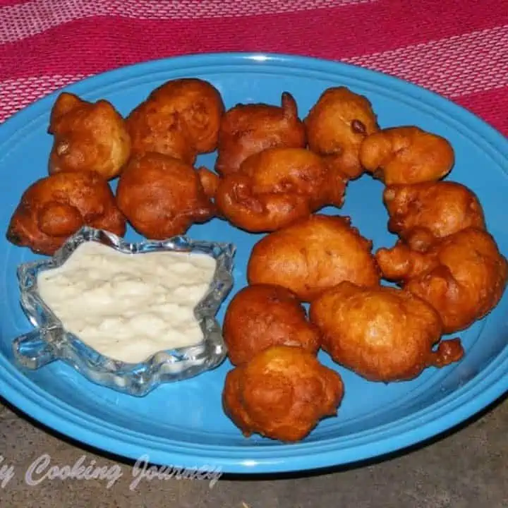 Goli Bajje in a blue plate with chutney on the side