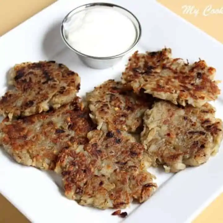 Latke with a side of sour cream - featured image