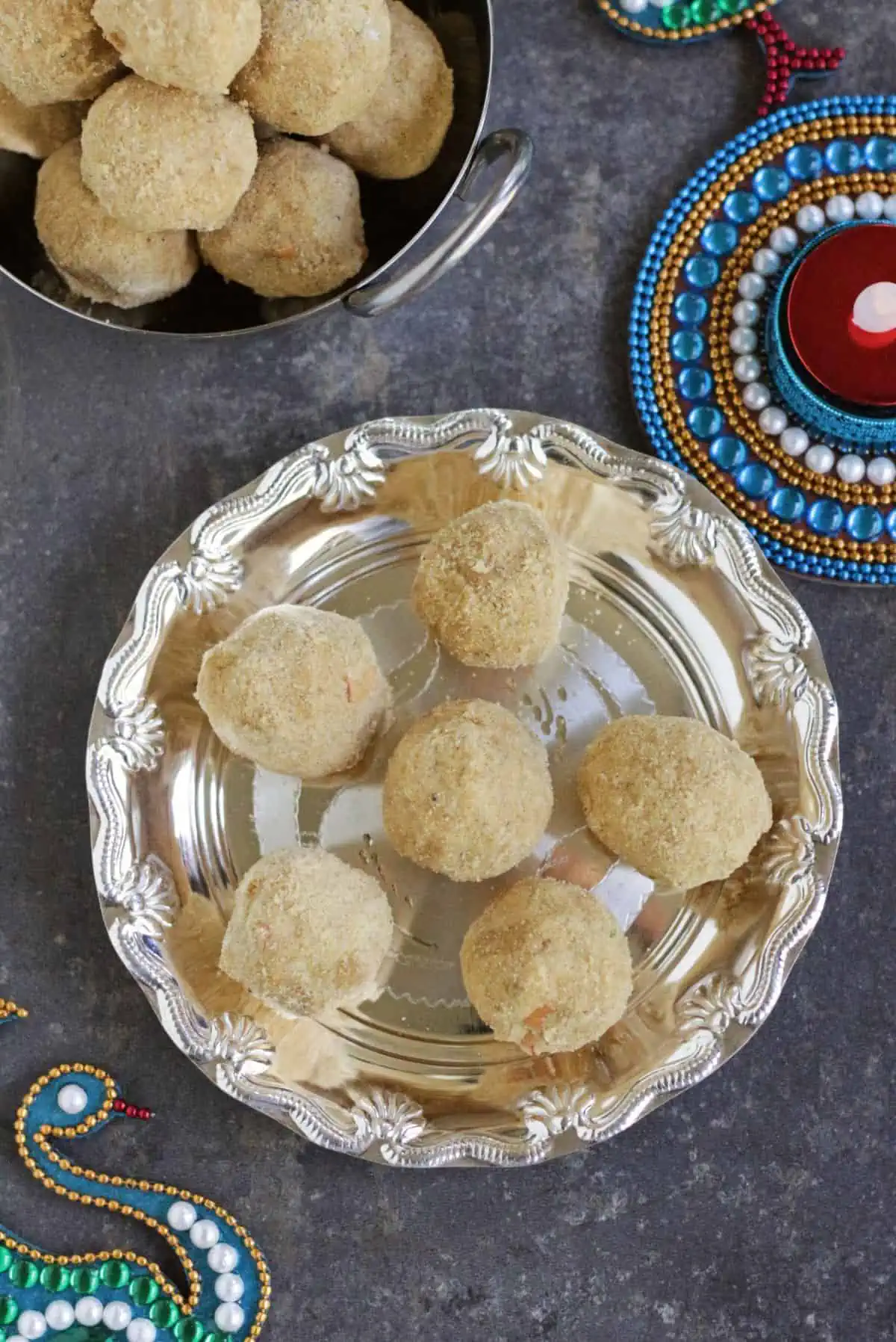 close up of ladoo in a silver plate.