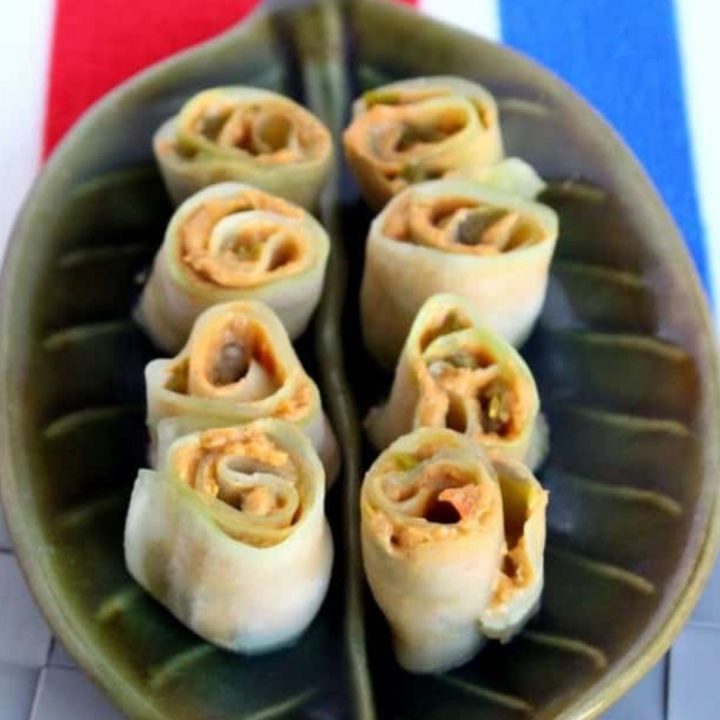 Cucumber roll-ups in a green plate - Featured Image