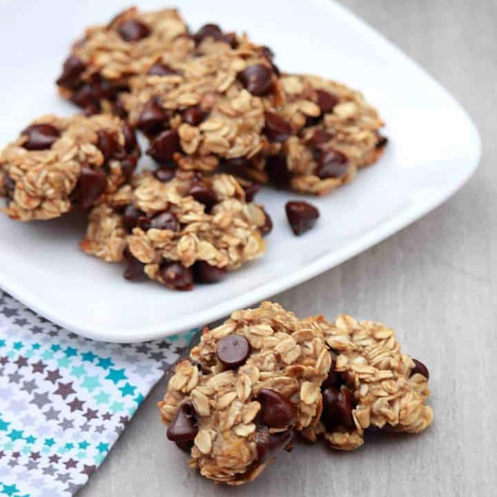 Banana Oatmeal Chocolate Chip Cookies in a white Plate and couple outside - Featured Image.