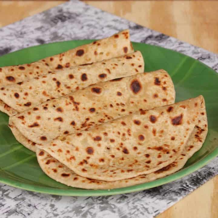 Maharashtrian Style Puran Poli in a green plate - Featured Image
