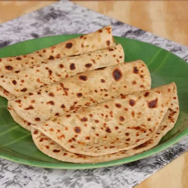 Maharashtrian Style Puran Poli in a green plate - Featured Image