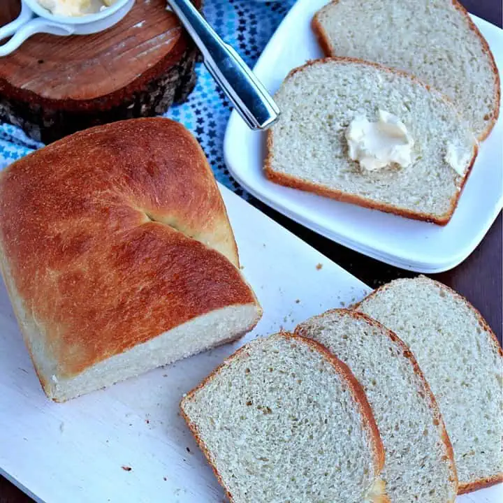 Victorian Milk Bread on a white plate with butter - Featured Image