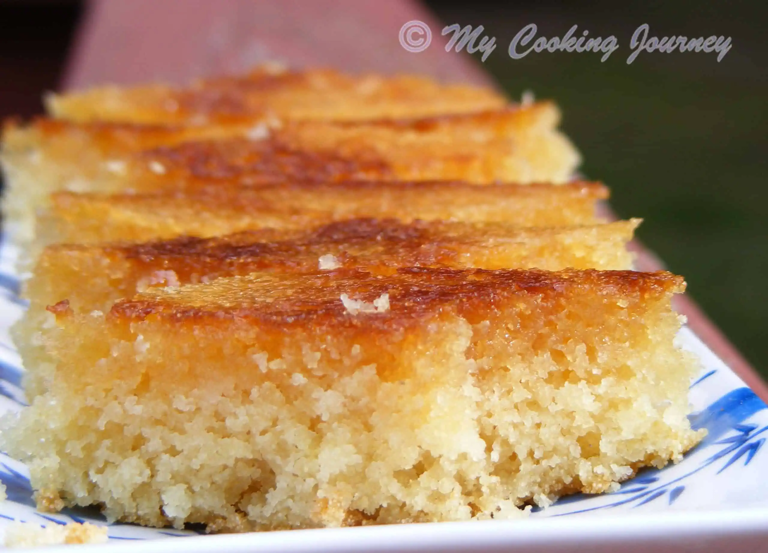 Honey Drizzled Semolina cake in a plate - Side View