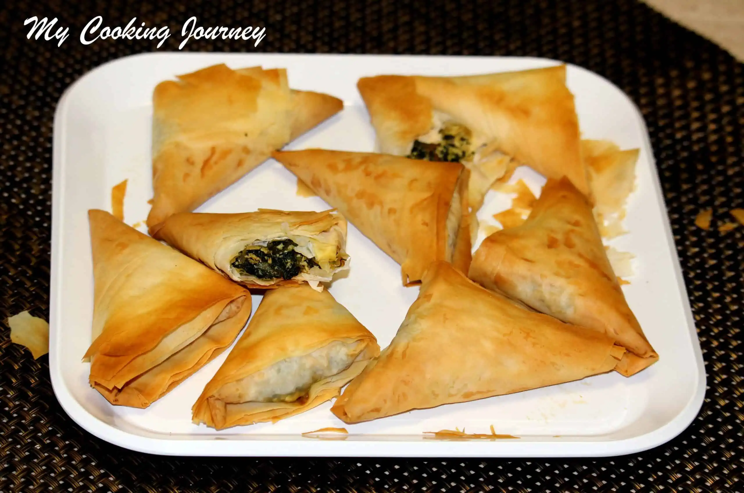 Spinach and Paneer Samosa in a white plate