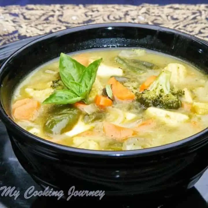 Thai Green Curry in a black bowl - Featured Image