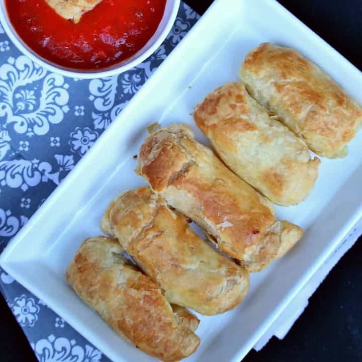 Mozzarella Sticks with Pastry Sheet in a white plate - Featured Image.